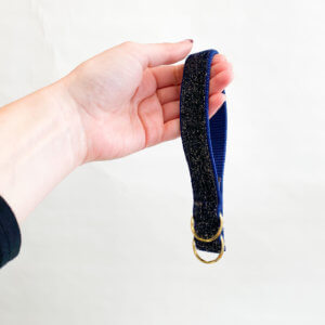glitter velvet starlight key fob with hand holding it