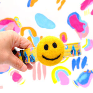 dog collar smiley face leopard background